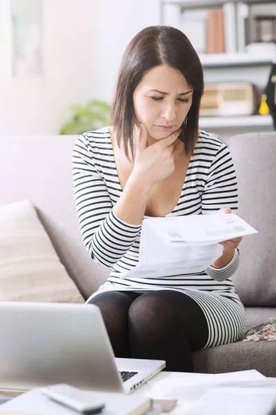 Woman Looking at Paperwork