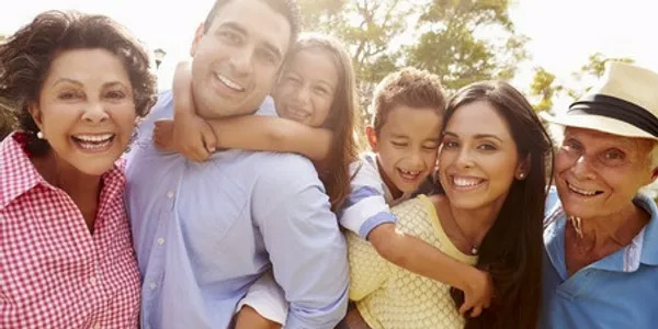 Family Outside Smiling for Picture