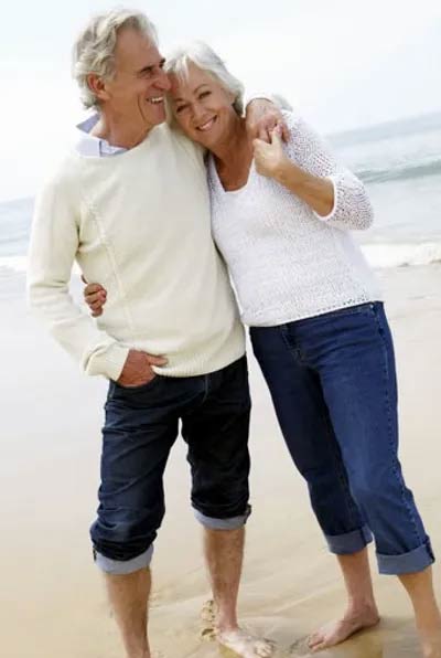 Man with Arm Around Woman on Beach