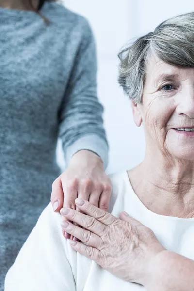 Hand on Older Woman's Shoulder